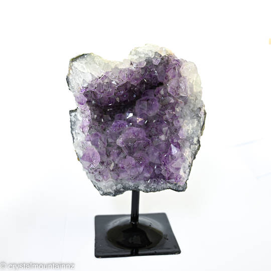 Amethyst Druze on a black metal stand. image 0
