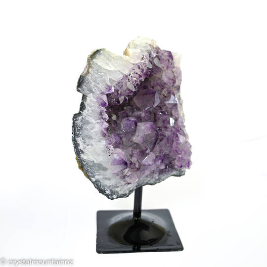 Amethyst Druze on a black metal stand. image 1