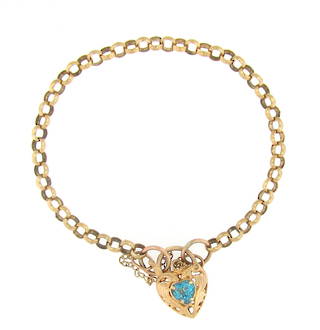 9ct yellow gold bracelet with a topaz set locket