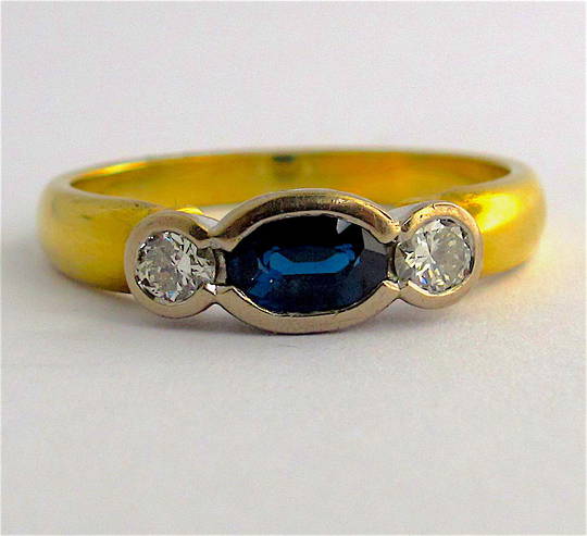 18ct yellow and white gold sapphire and diamond rub over style ring