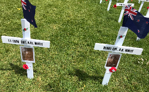 Crosses decorated with photos and flags