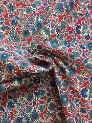Cotton spandex floral pattern on red BG