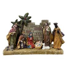 NATIVITY IN FRONT OF GREY STONE WALL