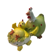 14CMH CHICKEN IN LIGHT GREEN OVERALLS PUSHING CHICK IN EGG