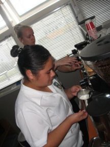 Naomi and Courtney making fair trade coffee