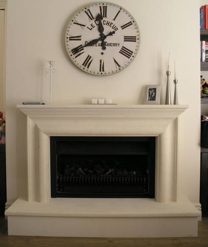 Bolection style fireplace with raised hearth carved in Oamaru Limestone