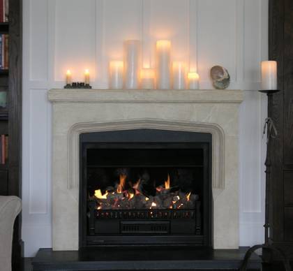 Larger Arts and Crafts fireplace mantle carved in Oamaru Limestone with aged patina and Bluestone hearth