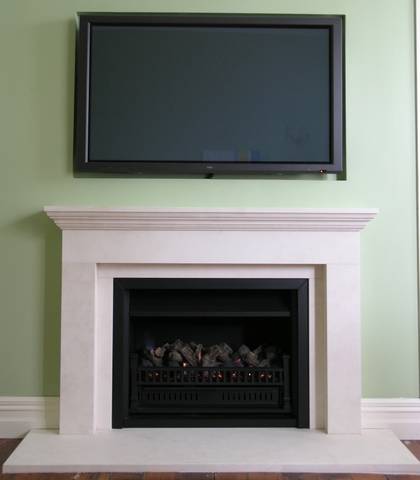 Linear styled fireplace with TV recessed above