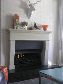 French Provincial inspired fire surround carved in Hinuera stone with optional Bluestone hearth and reveal slips.