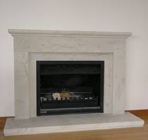 Classical linear styling with Tuscan moulding to mantle carved in Hinuera Stone