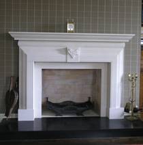 Classical 18th Century Georgian design fireplace, with Spooners' Boars Head Coat of Arms detail, carved in Portuguese Limestone