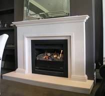 Classical fire surround with trim to internal edge, carved in Portuguese Limestone