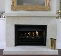 Bevelled fire surround carved in Hinuera Stone