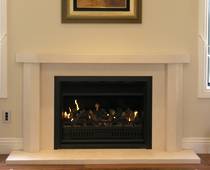 Contemporary fire surround with bevel to outer edge of mantle and jambs, carved in Portuguese Limestone