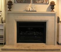 Contemporary fire surround with border and radius to internal edge carved in Hinuera Stone