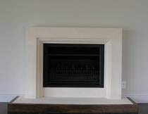 Contemporary styled fireplace carved in Oamaru Limestone with moulding to internal edge