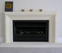 Contemporary fire surround 'connecting curve' design hand carved in Oamaru Limestone