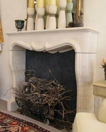 French Louis XIV fireplace hand carved in Oamaru Limestone with aged patina