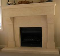 French Provincial fireplace with large block lintel carved in Oamaru Limestone with aged patina
