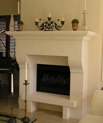 Italianesque styled fireplace mantle with raised hearth carved in Oamaru Limestone