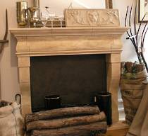 XV11C French fireplace design carved in Oamaru Limstone with Aged Patina