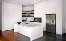 Villa kitchen is light + white in Mt Eden