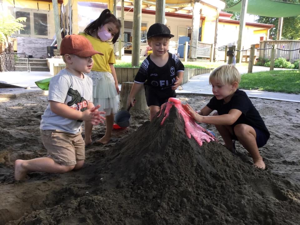 children playing in sand pit at flatbush childcare