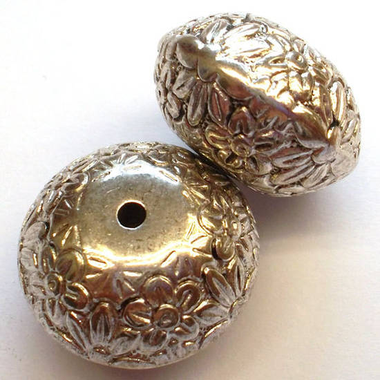 Metalised plastic, large fat rhondelle bead with flower imprint