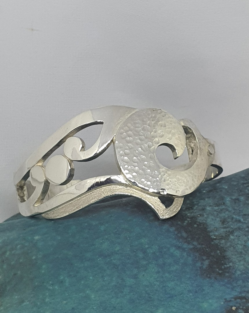 Chunky sterling silver cuff bangle with koru designs