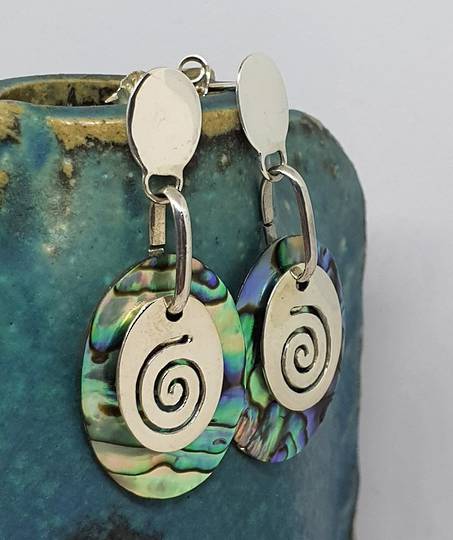 Silver paua shell earrings with silver koru disc