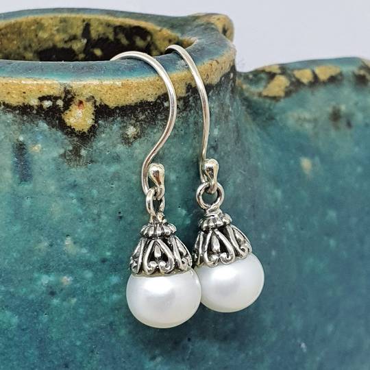 Classic pearl drop earrings with silver detail