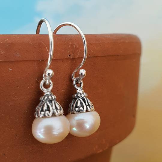 Classic pearl drop earrings with silver detail