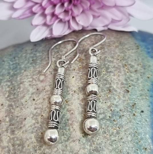 Long silver earrings with stunning designs