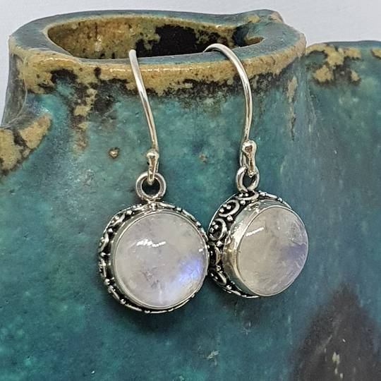 Circular silver moonstone earrings with filigree detailing