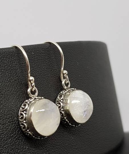 Circular silver moonstone earrings with filigree detailing