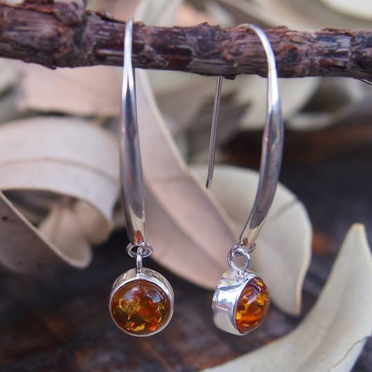 Silver amber earrings on long stems