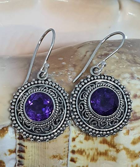 Silver earrings with purple stone