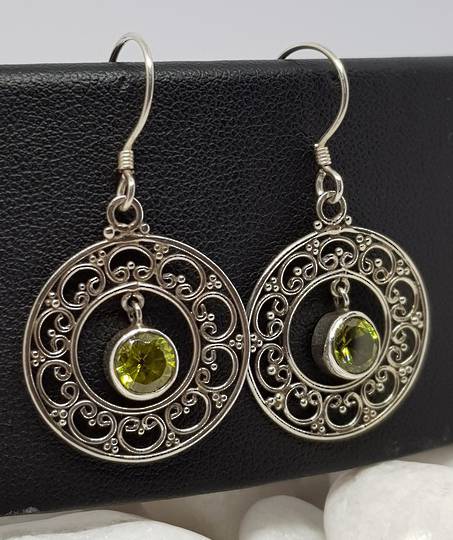 Silver lace hoop earrings with green peridot