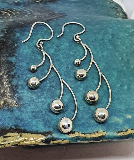 Long silver multi sphere earrings