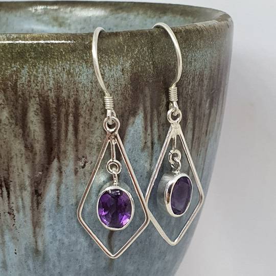 Silver hook earrings with oval purple gemstone