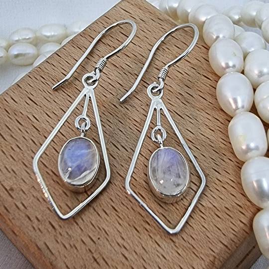Silver hook earrings with oval moonstone