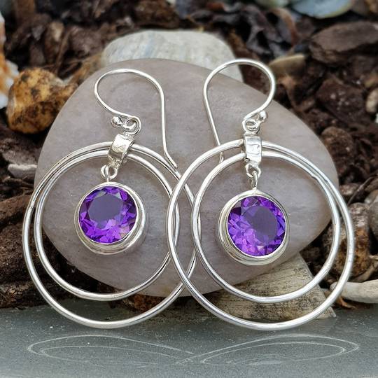 Silver hoop earrings with purple gemstone