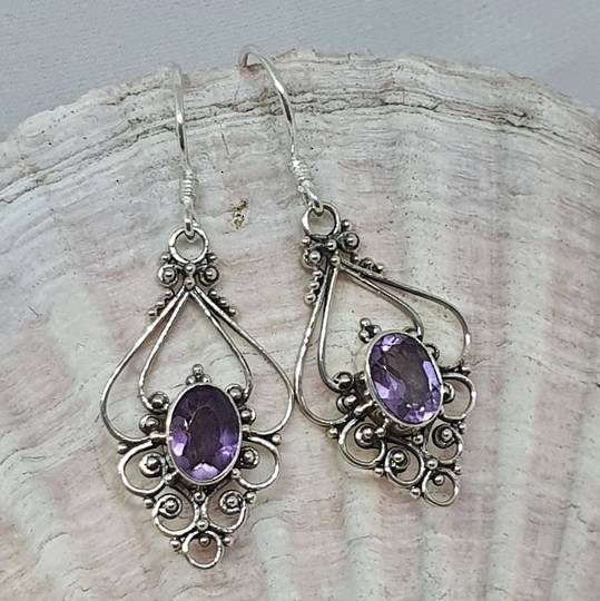 Silver filigree earrings with purple gemstone
