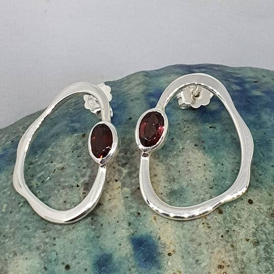 Open wonky oval shape garnet earrings