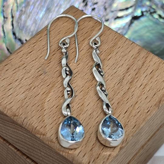 Silver long stemmed blue topaz teardrop earrings