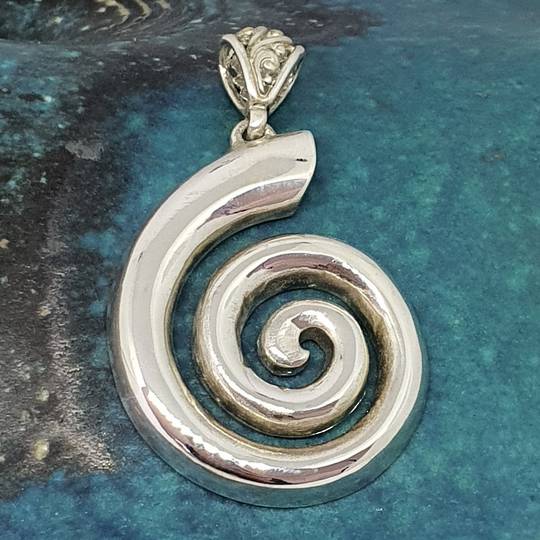 Solid silver koru pendant - made in NZ