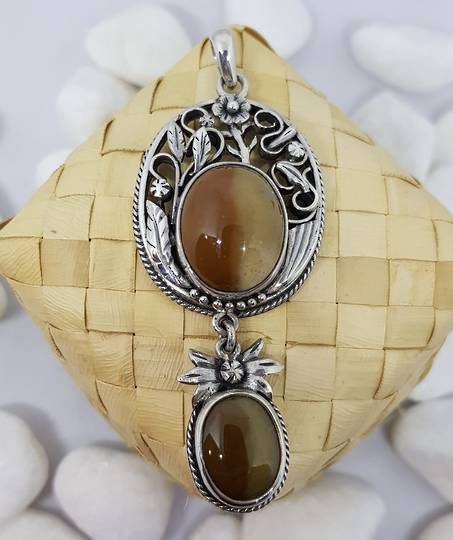 Silver pendant with brown gemstones