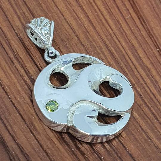 Made in NZ silver koru inspired pendant