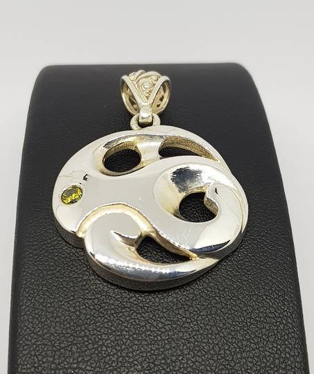 Made in NZ silver koru inspired pendant