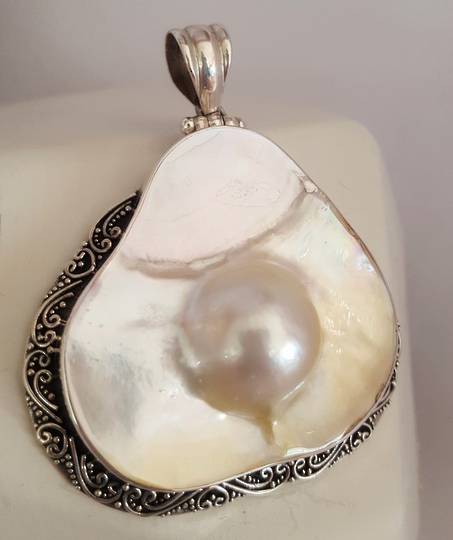 Large mother of pearl pendant with blister pearl